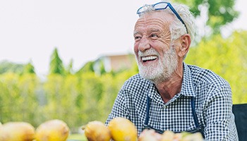 man smiling while outside 