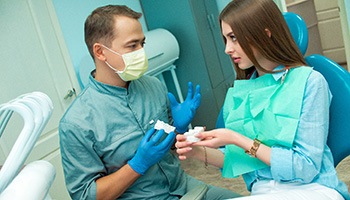 Invisalign patient in Barnegat Township talking to dentist