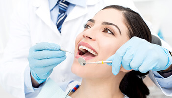 patient smiling during dental checkup 